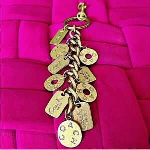 Coach vintage model #92124, featuring multiple hammered coin charms RARE!